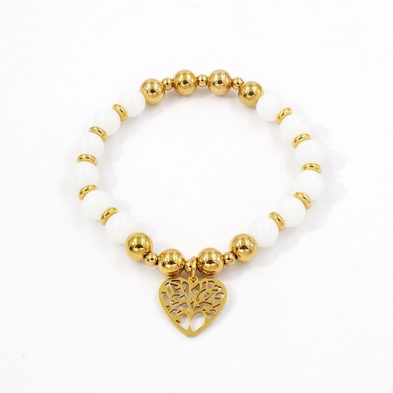 Pulsera dorada y piedras blancas
