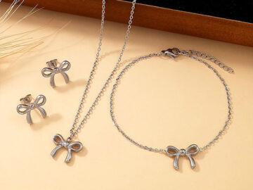 Set plateado aretes, pulsera y collar moñitas