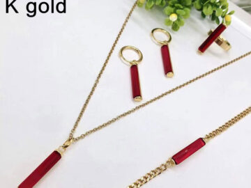 Set dorado 4 piezas piedra roja alargada