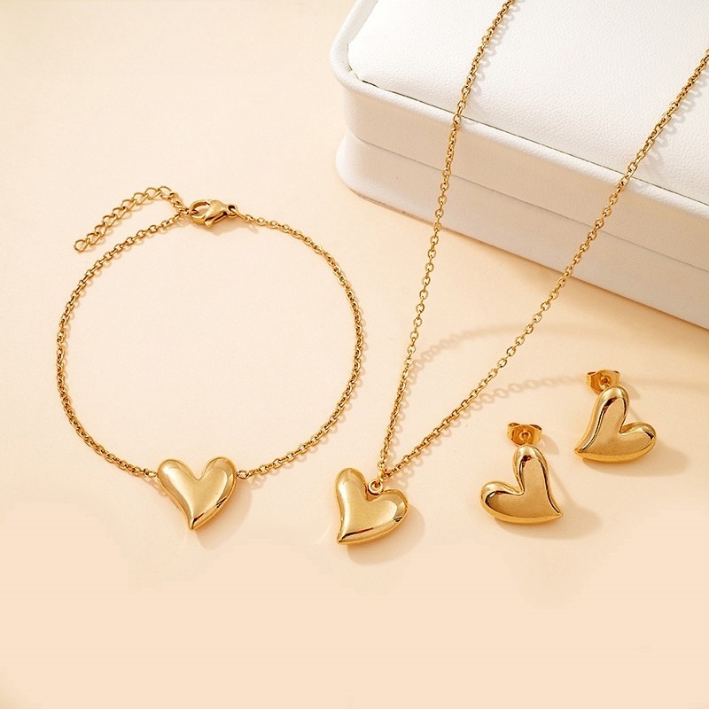 Set dorado 3 piezas dijes corazones