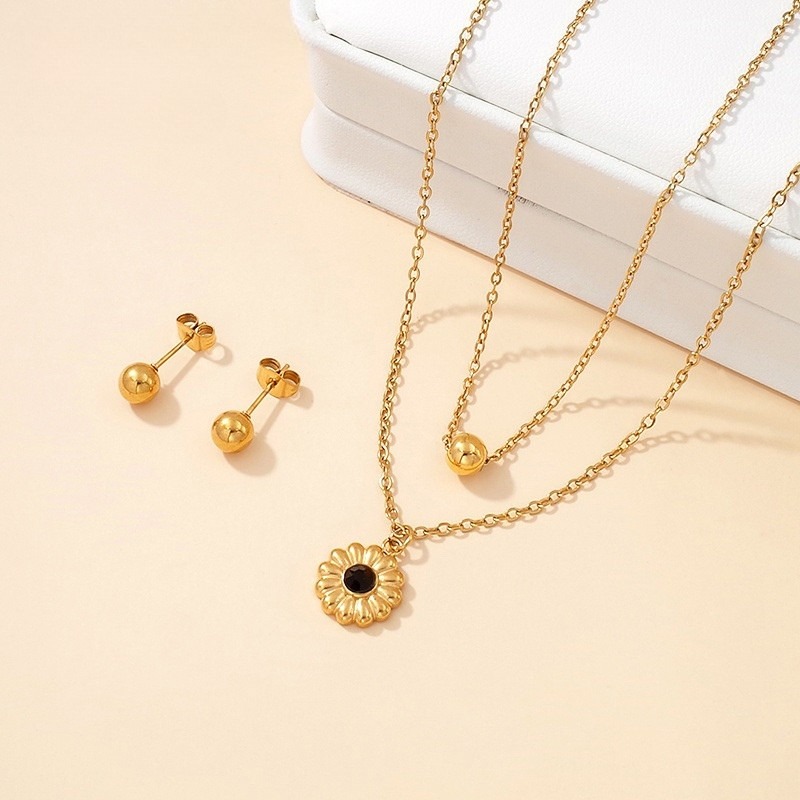 Set dorado collar doble dije flor